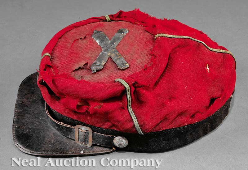 Louisiana Washington Artillery Civil War Kepi: A Louisiana Washington Artillery Civil War Kepi, wool, leather bill, brass eagle and shield buttons, the top with crossed-cannon badge, note: losses Note: The Washington Artillery was organized in 183