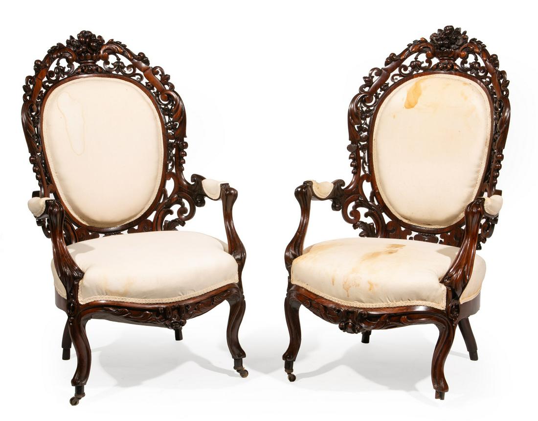 Rococo Carved and Laminated Rosewood Armchairs: Rare Pair of American Rococo Carved and Laminated Rosewood Armchairs, mid-19th c., New York, floral urn crest, scrolled reticulated foliate crest rail, padded back and arms, foliate seat rail, cabriol