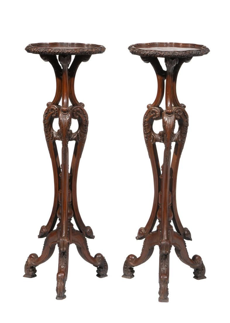 Pair of English Carved Mahogany Torcheres: Pair of English Renaissance Revival Carved Mahogany Torcheres, scalloped top, foliate scrolled tripod base, h. 42 1/2 in., dia. 14 1/4 in. Provenance: The Schoenberger Collection, 1812 Palmer Avenue, 
