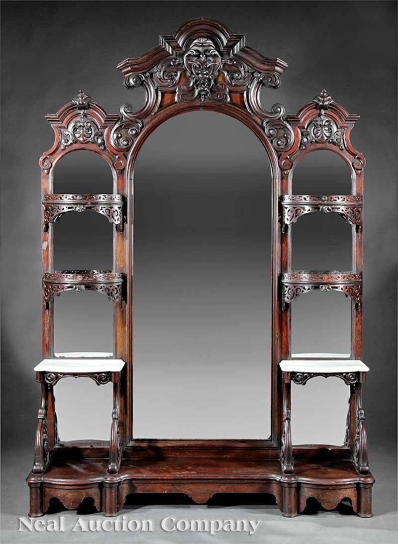 Laminated Rosewood Etagere attrib. to Belter: An American Rococo Carved and Laminated Rosewood Etagere, mid-19th c., attributed to John Henry Belter, New York, the arched molded crest with floral and scroll carving, tripartite arched mirrored bac