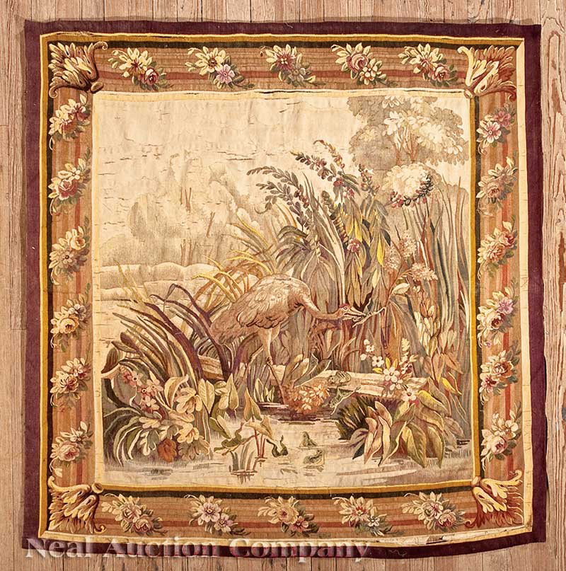 French Aubusson-Style Verdure Tapestry: An Antique French Aubusson-Style Verdure Tapestry, late 19th c., central scene depicting a stork and frog from the Aesop Fable "The Frogs who Desired a King", foliate ecoinçons, floral motif border, 