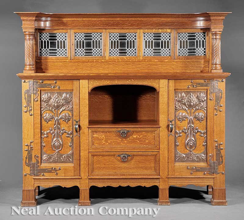 Carved Oak and Chased Copper Server: An English Arts and Crafts Carved Oak and Chased Copper Server, c. 1880, incurvate molded cornice, superstructure with four leaded glass doors, lower case with open niche and two drawers, flanked by t