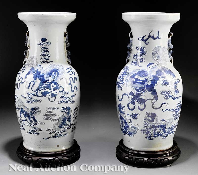 Chinese Blue and White Decorated Porcelain Vases: A Pair of Chinese Blue and White Decorated Celadon Ground Porcelain Vases, 19th c., baluster bodies with pairs of confronting Buddhist lion handles applied to the necks, each decorated in near mirror 