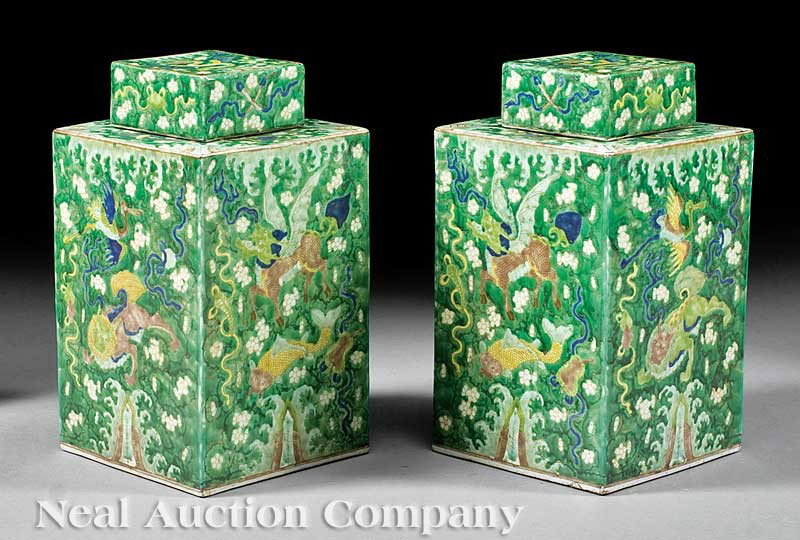 Chinese Famille Verte Porcelain Tea Caddies: A Pair of Chinese Famille Verte Porcelain Tea Caddies, Kangxi marks but 20th c., square bodies and covers, overall mythical beast decoration and Buddhist emblem design, bases with apocryphal Kangxi ma