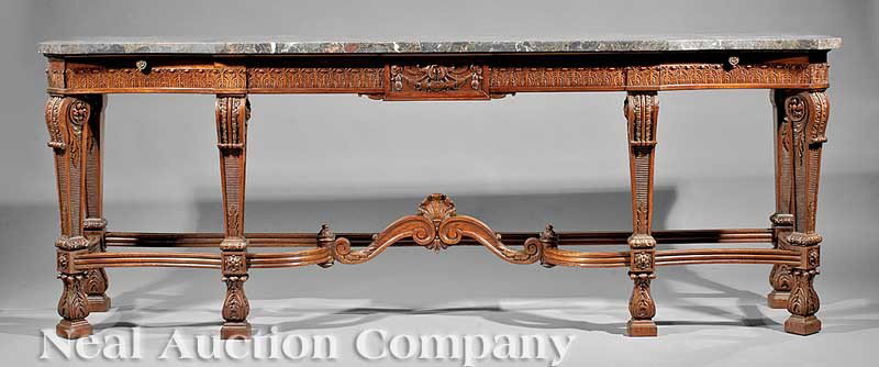 Carved Mahogany and Marble Console Table: A Good Antique Continental Carved Mahogany and Marble Console Table, late 19th c., shaped variegated marble top, three frieze drawers centered by a bellflower swagged panel, scrolled blocked and acant