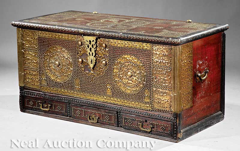 Moroccan Carved "Medina" Dower Chest: An Antique Moroccan Carved "Medina" Dower Chest, early 20th c., hinged lid with decorative brass hardware, open interior, overall extensive brass tack and pierced brass decoration, three drawers below