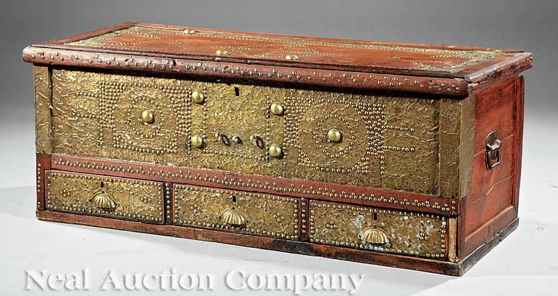 Moroccan Carved "Medina" Dower Chest: An Antique Moroccan Carved "Medina" Dower Chest, early 20th c., higned lid, three drawers below, overall extensive hammer and brass tack decoration, brass handles, height 18 in., width 46 1/2 in., dep