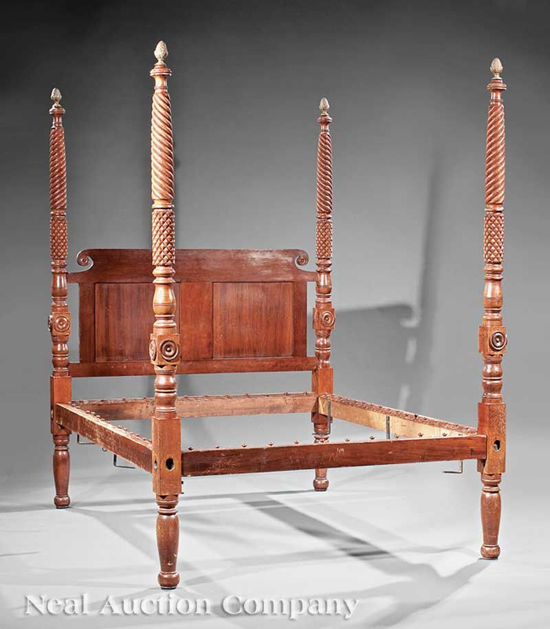 Classical Carved Cherrywood Four Poster Bed: An American Classical Carved Cherrywood Four Poster Bed, c. 1825, spiral turned, pineapple carved posts with associated brass finials, paneled headboard with a scrolled and bossed crest, conforming pe