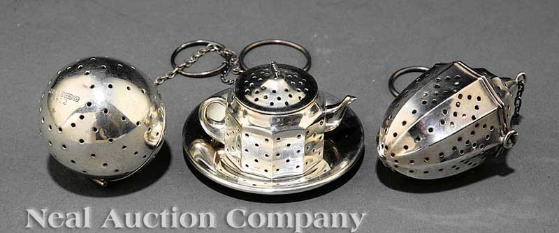 Three American Sterling Silver Tea Balls: Three American Sterling Silver Tea Balls, including a teapot-shaped by Am Craft, a top-shaped by Webster and a ball-shaped by Blackinton, combined weight 2 troy ozs