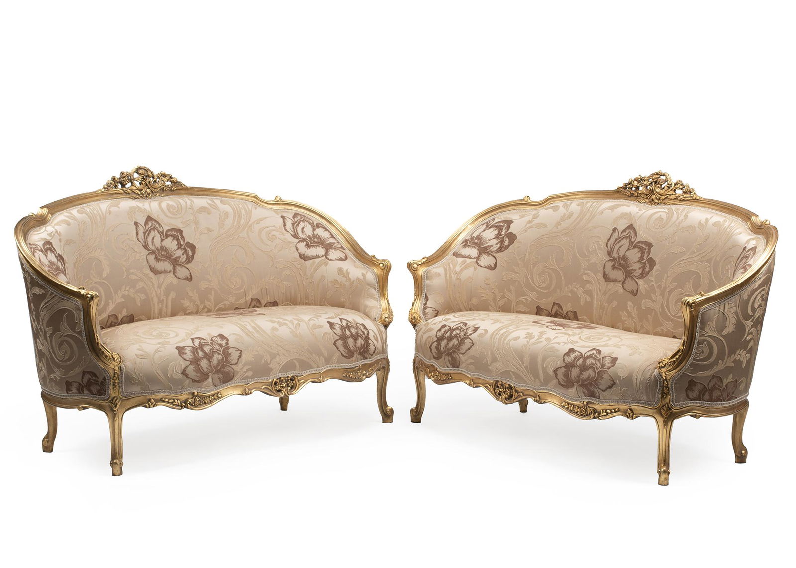 Pair of Louis XV-Style Carved Giltwood Settees: Pair of Louis XV-Style Carved Giltwood Settees, reticulated floral crest, scrolled crest rail, serpentine seat rail, cabriole legs, scrolled toes, h. 39 in., w. 62 1/2 in., d. 29 in.