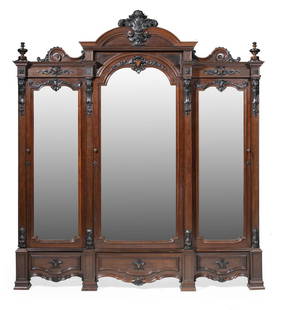 Carved Rosewood Triple Door Armoire, attr. Roux: Monumental American Rococo Carved Rosewood Triple Door Wardrobe, mid-19th c., attr. to Alexander Roux, New York, scrolled crest centered by acanthus medallion, mirrored doors with foliate decoration,