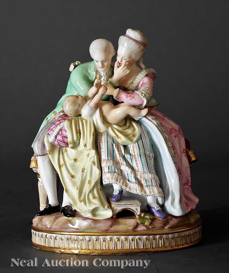 Meissen Polychrome Porcelain Couple Cradling Baby: A Meissen Polychrome Porcelain Figural Group of a Couple Cradling a Baby, late 19th c., underglaze blue crossed swords mark, colorfully costumed in the Rococo taste, seated on a Louis XVI bench, on an
