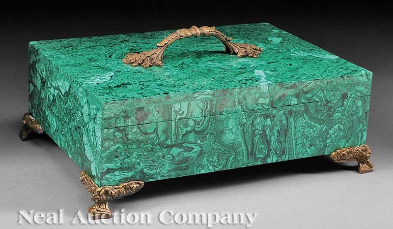 A Malachite and Bronze-Mounted Box: A Malachite and Bronze-Mounted Box, foliate handle, bracket feet, height 7 in., width 14 1/2 in., depth 10 1/2 in