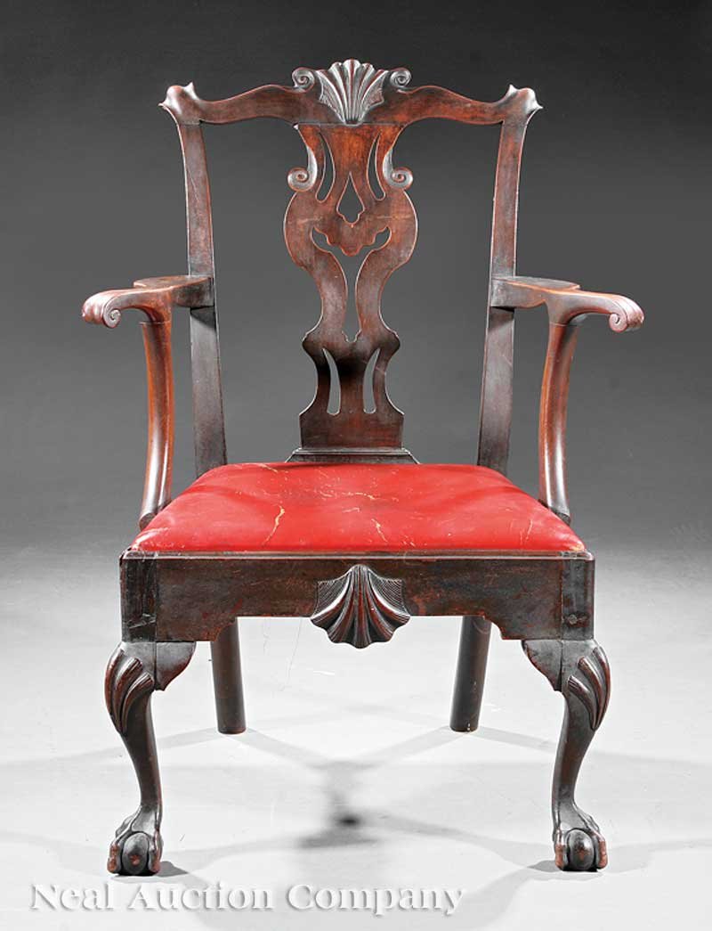 American Chippendale Carved Walnut Armchair: An American Chippendale Carved Walnut Armchair, 18th c., Philadelphia, shell carved crest, scrolled ears, serpentine knuckle arms, trapezoidal slip seat, shell carved and molded seat rail, shell carve