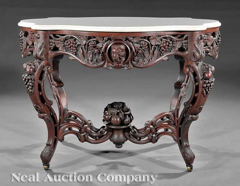 Rosewood Center Table attrib. Belter: An Important American Rococo Carved and Laminated Rosewood Center Table, c. 1850, attributed to John Henry Belter, New York, the serpentine white marble top above a conforming pierced skirt with grape