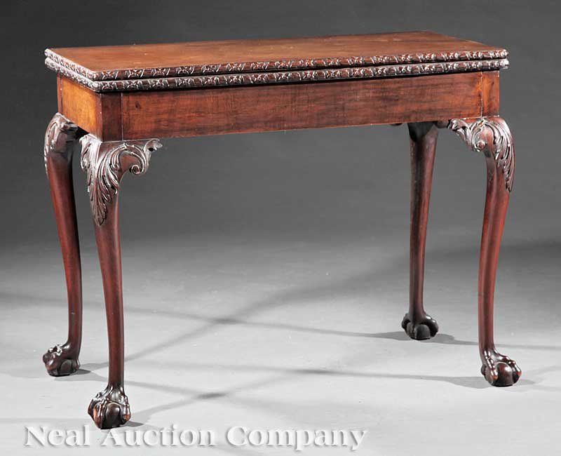 Georgian Carved Mahogany Games Table: A Georgian Carved Mahogany Games Table, c. 1760, rectangular foldover top, baize-lined playing surface, cabriole legs, claw and ball feet, height 29 in., width 36 1/2 in., depth 19 in