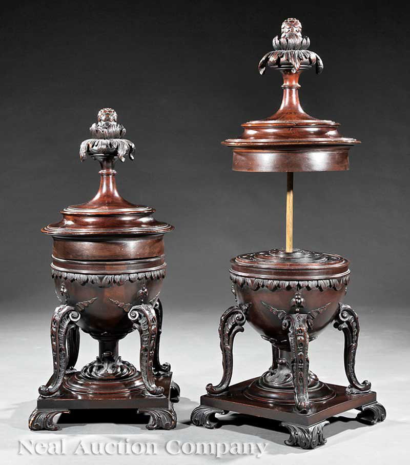Pair Carved Mahogany Knife Boxes: A Pair of George III-Style Carved Mahogany Knife Boxes in the Manner of Thomas Chippendale, mid-19th c., turned covers with acanthus finials, fitted domed body with leaf banding, bellflower carved cab