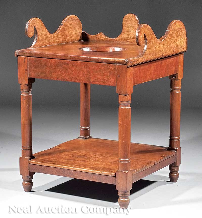 Southern Cherrywood and Walnut Washstand: A Southern Cherrywood and Walnut Washstand, early 19th c., vernacular scroll backsplash, top fitted for wash bowl, turned legs, stretcher shelf, turned feet, height 32 in., width 23 1/2 in., depth 23 