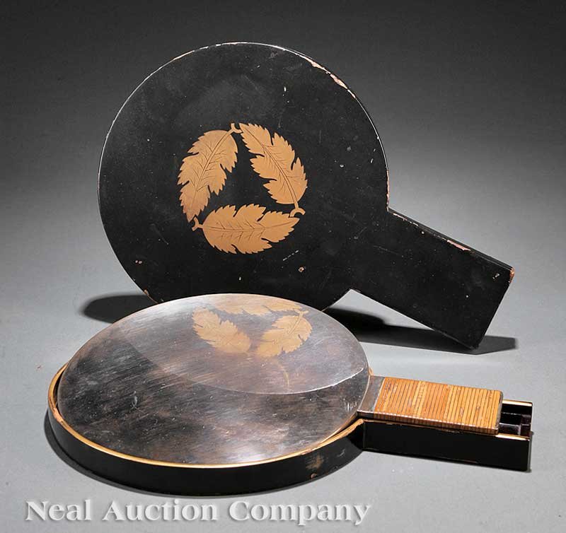 Japanese Polished Bronze Mirror in Wood Case: A Japanese Polished Bronze Mirror in a Gilt Decorated Lacquered Wood Case, Meiji Period (1868-1912), circular body relief modeled with a floral medallion encircled by pine, bamboo, cranes and a tortoi