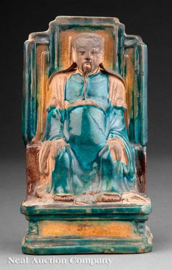 Chinese Fahua Glazed Pottery Figure of Immortal: A Chinese Fahua Glazed Pottery Figure of an Immortal, Ming Dynasty (1368-1644), male figure modeled seated on a tall throne, his hands resting on his knees, height 7 7/8 in., width 4 1/2 in. Note: Sma