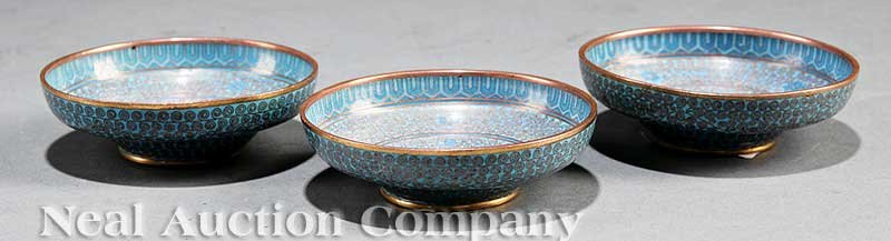 Chinese Cloisonne Enamel Small Dishes: A Set of Three Chinese Cloisonne Enamel Small Dishes, late 19th/early 20th c., circular bodies with steep walls and concave wells, raised on tapering circular feet, decorated throughout in rose colore