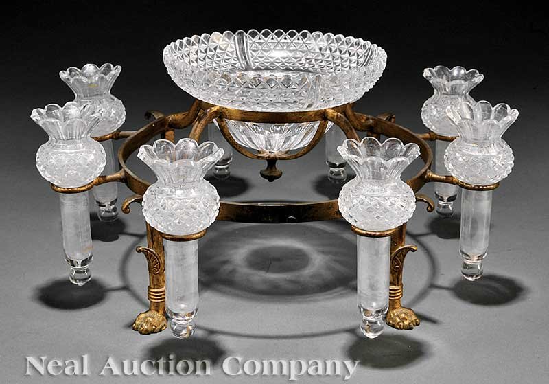 Continental Gilt and Cut Glass Epergne: A Continental Gilt and Cut Glass Epergne, central bowl amid eight bud vases in circular frame, on four legs with paw feet, height 7 in., diameter 14 3/4 in