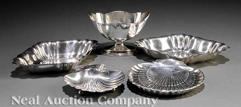 American Sterling Silver Dishes: A Group of Small American Sterling Silver Dishes, including a Tiffany shell dish, a Gorham shell dish, a Gorham footed bowl and two lozenge shaped dishes, combined weight 24.20 troy ozs
