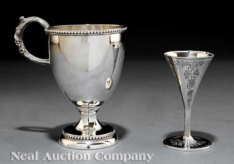 American Coin Silver Cordial Glass: An American Coin Silver Cordial Glass, with presentation inscription to the Rt. Rev. J.J. Williams, Bishop of Boston, 1866; together with a coin silver wine cup, c. 1850 Note: John J. Williams (1822-1