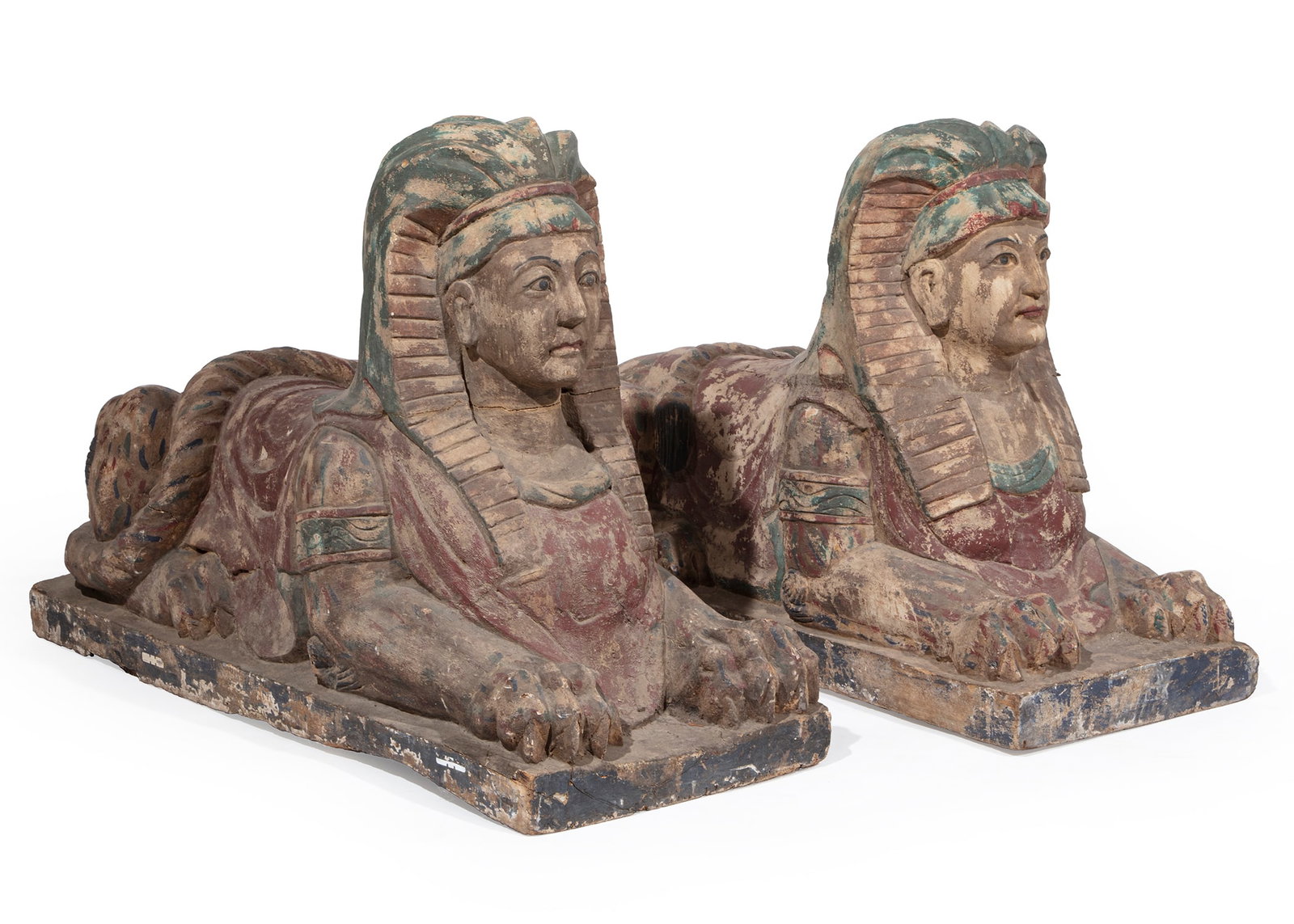 Pair of Large Carved Wood Sphinxes: Pair of Large Carved Wood Sphinxes, mid-20th c., surface retains areas of old paint, h. 33 in., w. 18 1/2 in., d. 46 1/2 in.