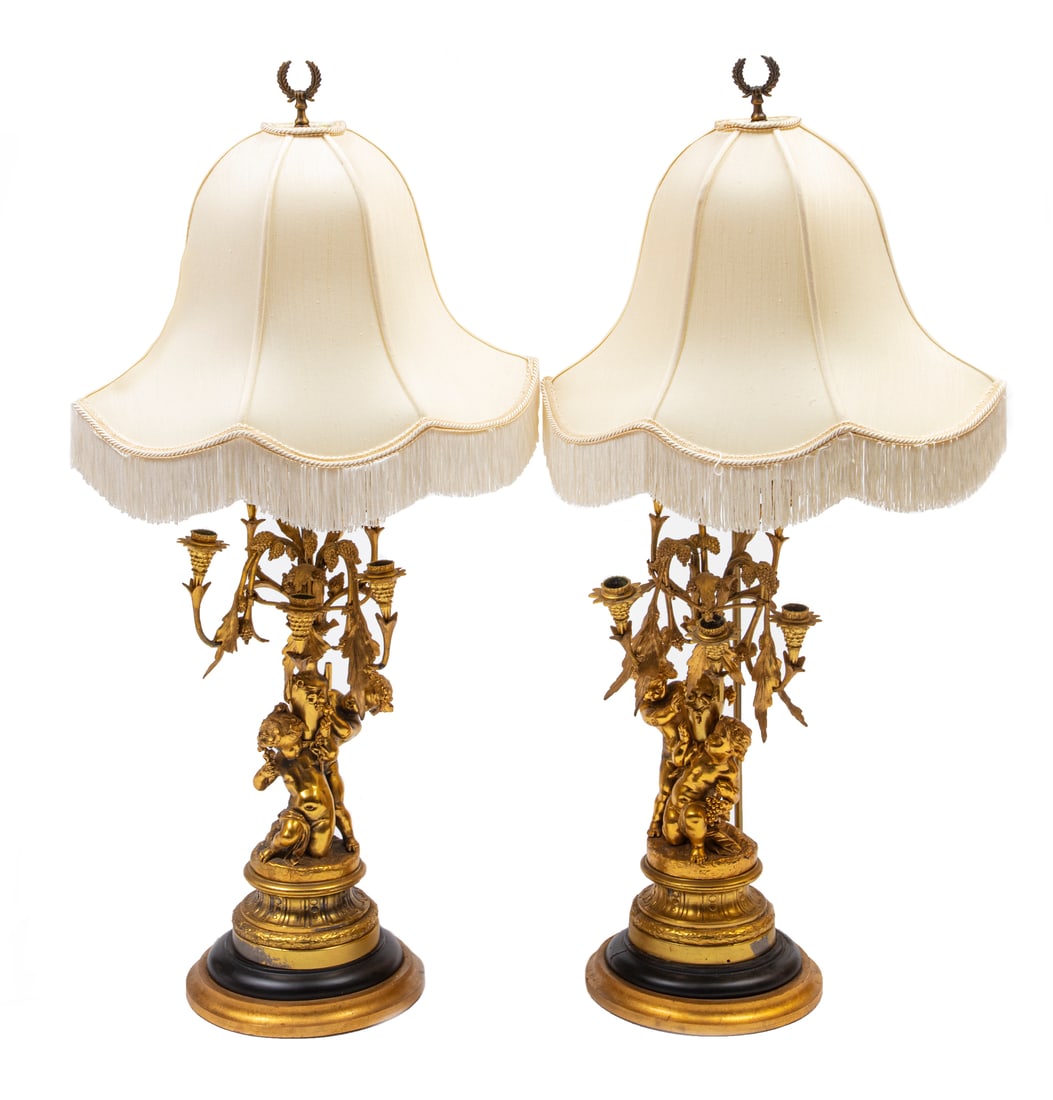 Pair of French Gilt Metal Six-Light Candelabra: Pair of French Gilt Metal Six-Light Candelabra, now mounted as lamps, cherub standard, wood base, candelabra h. 22 in., h. to socket 33 in.
