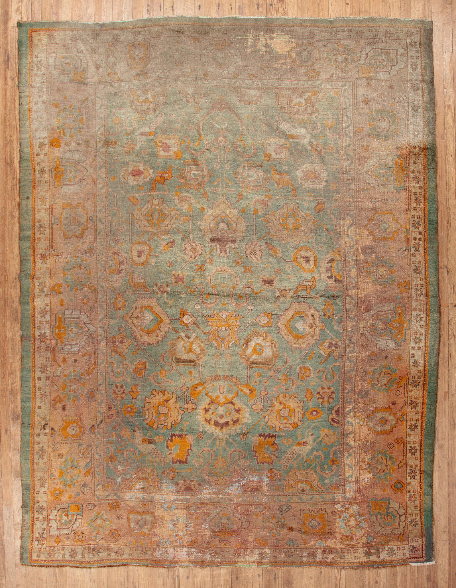 Oushak Carpet: Oushak Carpet , West Anatolia, late 19th c., 11 ft. x 15 ft., re-piled and restored areas, flat-stitch repairs, sun-faded areas