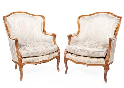 Pair of Louis XV-Style Carved Walnut Bergeres: Pair of Louis XV-Style Carved Walnut Bergeres, 20th c., labeled Henredon, molded crest rail, padded arms, cabriole legs Note: condition of upholstery, h. 36 in., w. 27 in., d. 30 in.