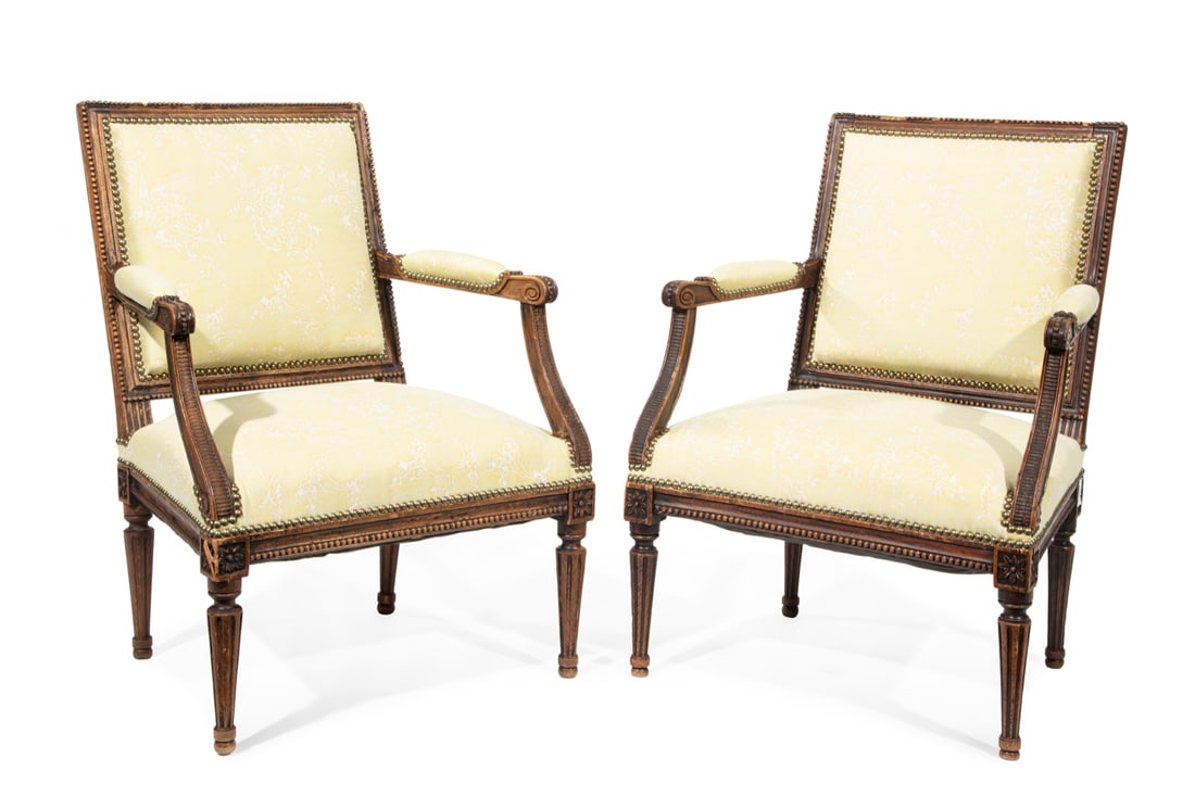 Pair of Louis XV-Style Carved Walnut Armchairs: Pair of Louis XV-Style Carved Walnut Armchairs, 19th c., beaded molded crest rail, padded arms, fluted tapered legs, h. 33 in., w. 24 in., d. 18 in.
