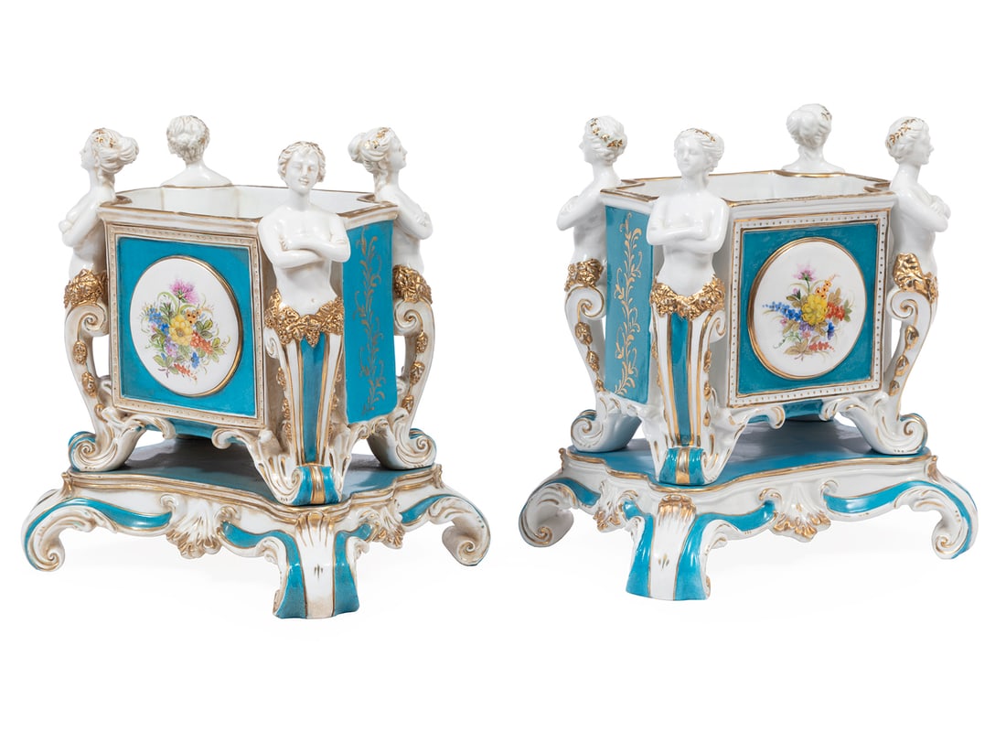 Minton-Style Porcelain Jardinieres: Pair of Minton-Style Gilt and Polychrome Porcelain Jardinières, 20th c., each flanked by male and female terms, scroll base, h. 12 3/4 in., w. 11 3/4 in., d. 9 in.