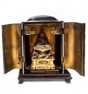 Japanese Lacquer Traveling Shrine: Antique Japanese Lacquer Traveling Shrine or Zushi with Carved and Gilt Wood Budhist Figure, the deity carved seated on lotus petal raised on rockwork atop a rectangular platform, h. 7 3/4 in., w. 5 i