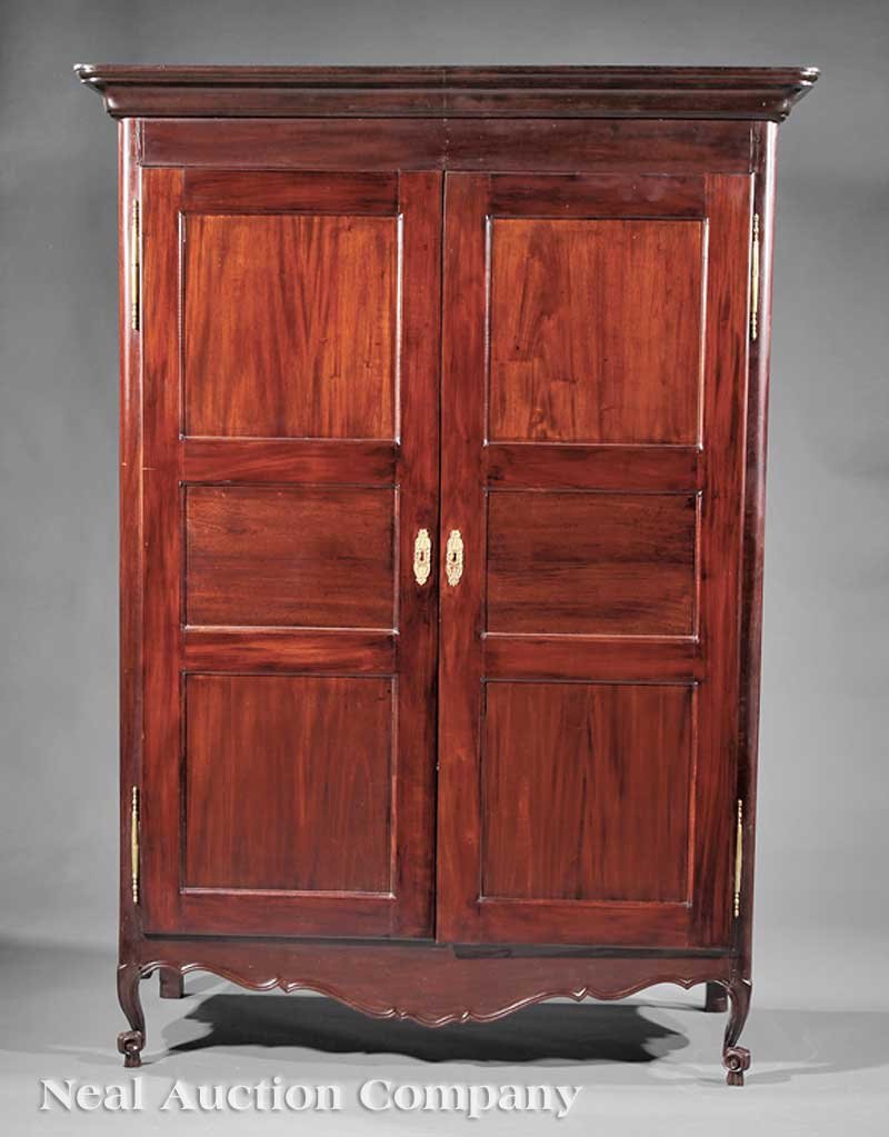 West Indies Purpleheart Armoire: A West Indies Purpleheart Armoire, 19th c., probably Martinique, molded cornice over paneled doors, fiche hinges, shelf interior, cabriole legs, scrolled toes on hoofs, height 79 in., width 56 in., de