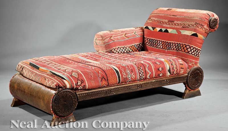 Contemporary Carved and Upholstered Chaises: A Pair of Contemporary Carved and Upholstered Chaises, each with scrolled back, baluster support with floral terms, Southwest-style upholstery, height 32 in., length 76 1/2 in., width 32 in