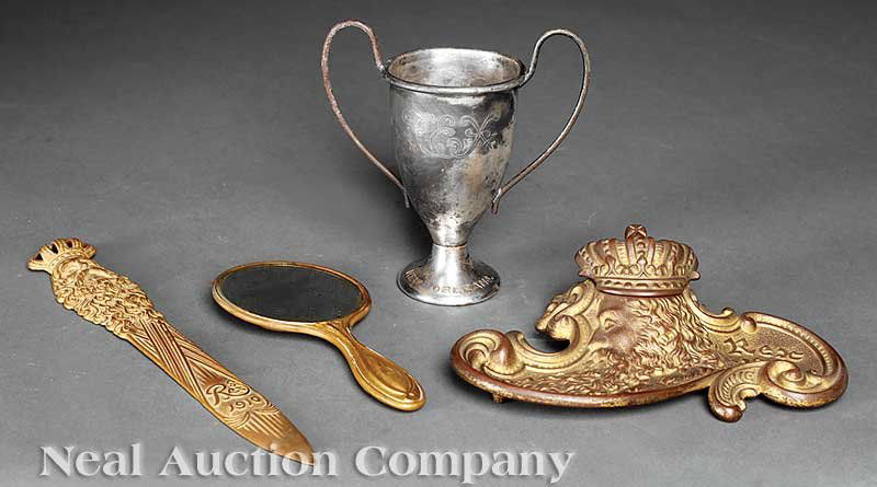 Mardi Gras Four Rex ball favors: [Mardi Gras], four Rex ball favors including 1912 hand mirror, 1910 letter opener, 1911 inkwell and 1914 silverplate loving cup