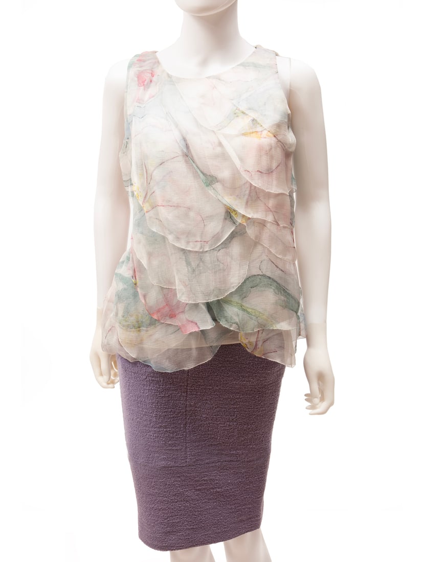 Chanel 2012 Runway Resort Lilac Boucle Skirt: Chanel 2012 Runway Resort Lilac Boucle Skirt, 2012, Look 6, labeled "CHANEL" and "Made in France", tag numbered "P42621V30847" and "AV893", size 38; together with Chanel multicolor floral print ruffle