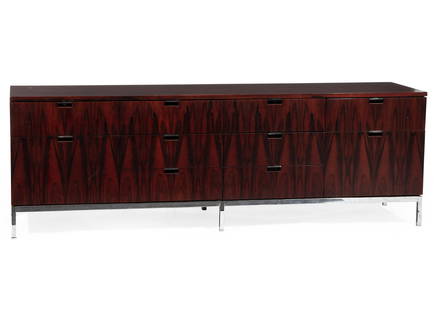 Florence Knoll Cabinet: Florence Knoll Cabinet, 1960s, rosewood, bookmatched grain, ten drawers, original pulls, oak interior, polished steel frame,, h. 25 in., w. 74 1/2 in., d. 18 in. Provenance: Treadway Toomey, Oak Park,