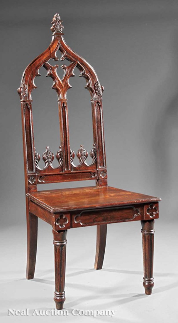 American Gothic Carved Oak Hall Chair: An American Gothic Carved Oak Hall Chair, c. 1850, cathedral back, square seat, carved tapered legs