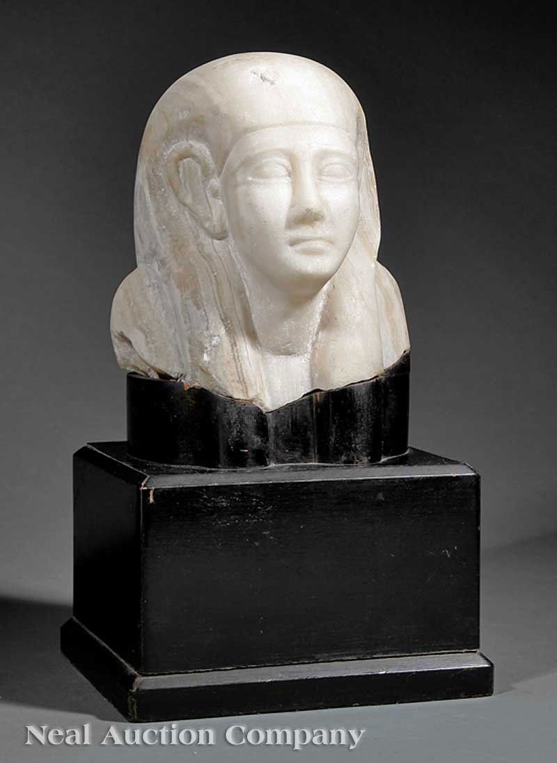 Egyptian Carved Alabaster Head of Male Figure: An Egyptian Carved Alabaster Head of a Male Figure, on a fitted ebonized base, overall height 13 1/4 in