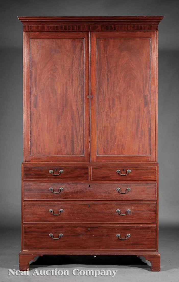 American Chippendale Mahogany Linen Press: An American Chippendale Mahogany Linen Press, late 18th c., New York or New Jersey, molded cornice, paneled doors enclosing shelves, two over three graduated drawers, bracket feet, height 91 1/2 in.,