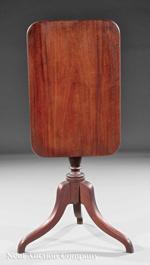 Late Federal Mahogany Tilt-Top Candlestand: An American Late Federal Mahogany Tilt-Top Candlestand, early 19th c., rectangular top with rounded corners, on bold vasiform shaft, arched spider legs, height 29 1/2 in., width 26 in., depth 17 in