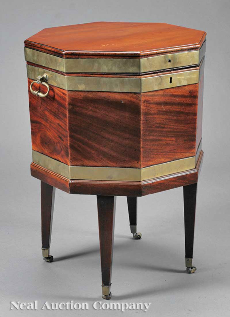 Brass-Bound Mahogany Cellarette on Stand: A George III Brass-Bound Mahogany Cellarette on Stand, c. 1800, divided interior, retains old zinc lining, brass handles, stand on square tapered legs, casters, height 25 1/2 in., diameter 19 in