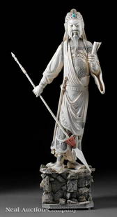 Chinese Gem Inset Stained Ivory Figure of Guandi: A Large and Impressive Chinese Gem Inset Stained Ivory Figure of Guandi/Guangong, the guardian of the Daoist faith and honorary patron of literature carved standing in a slightly swayed stance,