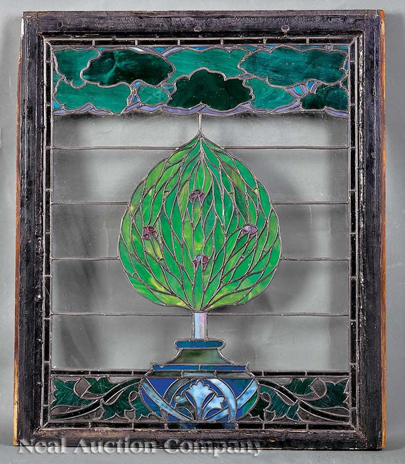 Leaded and Stained Glass Window: A Leaded and Stained Glass Window, the upper panel of stylized trees, central topiary, lower panel of foliate vines, overall height 38 1/2 in., width 32 1/8 in