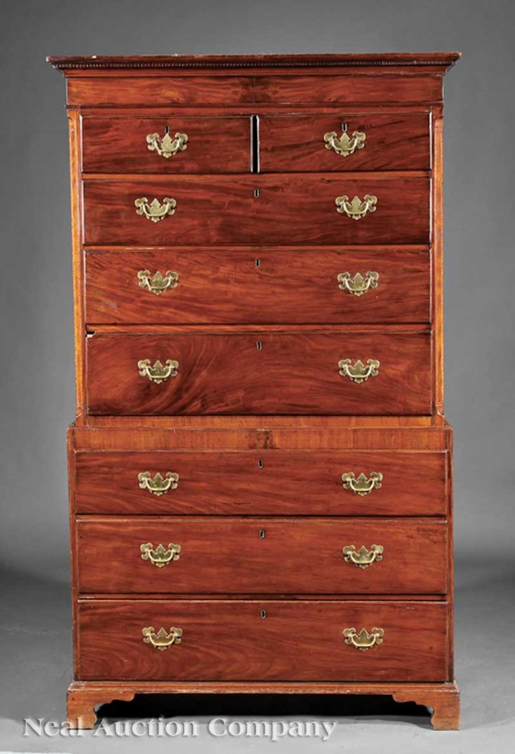 George III Carved Mahogany Chest-on-Chest: A George III Carved Mahogany Chest-on-Chest, 18th c., upper case with dentil molded cornice, plain frieze, two over three graduated drawers, chamfered inlaid corners; lower case with three graduated d