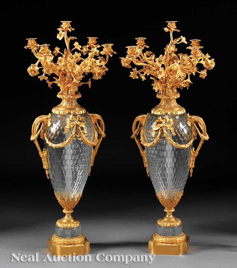 Cut Crystal and Bronze Dore Candelabra: A Pair of Monumental Cut Crystal and Bronze Dore Five-Light Candelabra, floral candlearms over faceted baluster standard, mounted with acanthine handles and swags, height 42 in., diameter 17 in