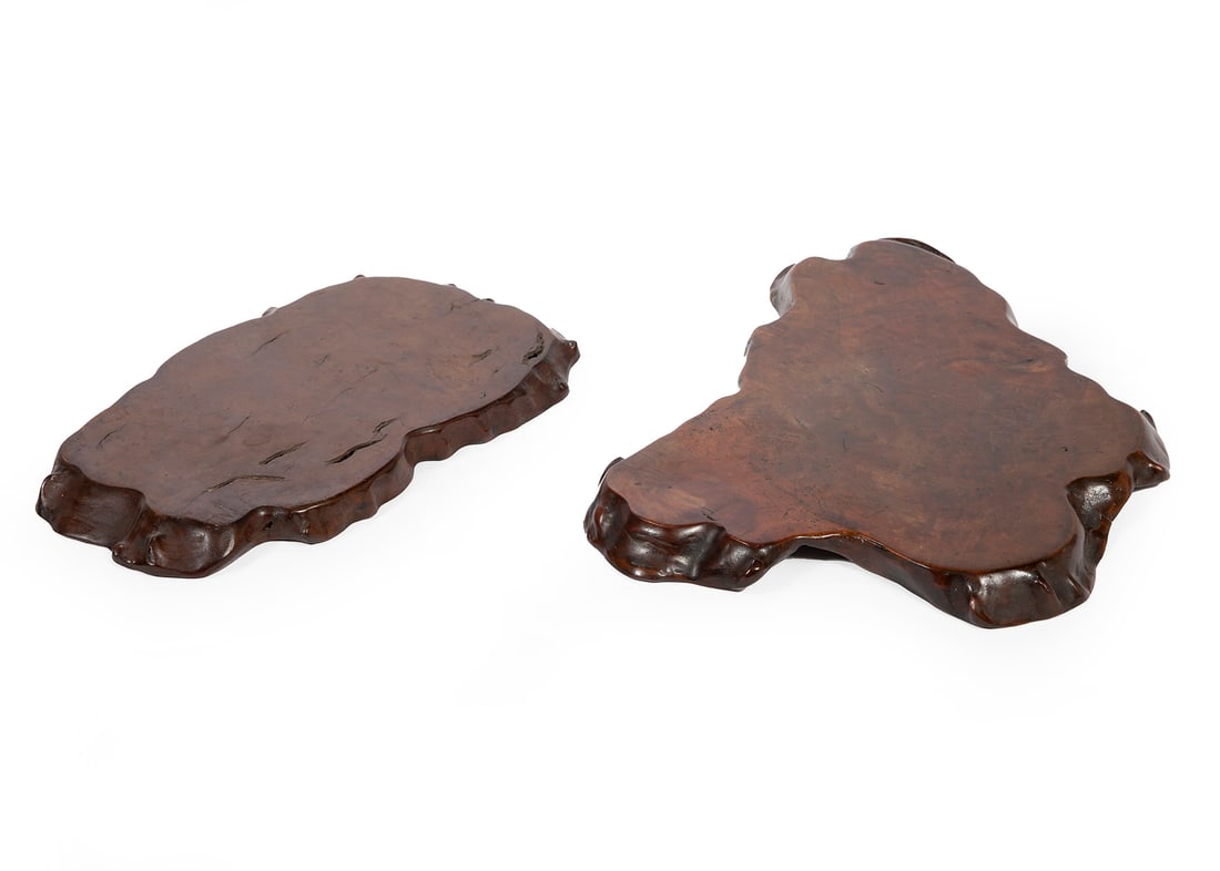Two Chinese Burlwood Shaped Platform-Stands: Two Chinese Burlwood Shaped Platform-Stands, Huamu, l. 11 in., w. 9 1/2 in. and l. 9 1/2 in., w. 5 3/4 in. Provenance: The Estate of Caroline P. Ireland.